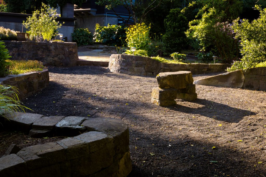 Eric Contey Stonework - DeGarmo patio at sunrise, with bench, walls, and stairs